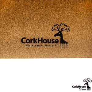 A close up view of the corkhouse logo on the bottom of a natural cork yoga mat. 