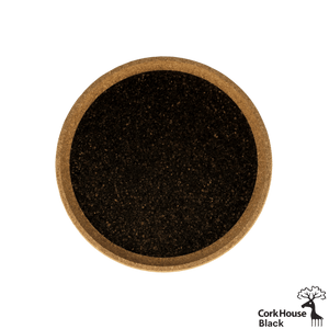 Overhead shot of the circular black cork tray with a natural-colored raised lip.