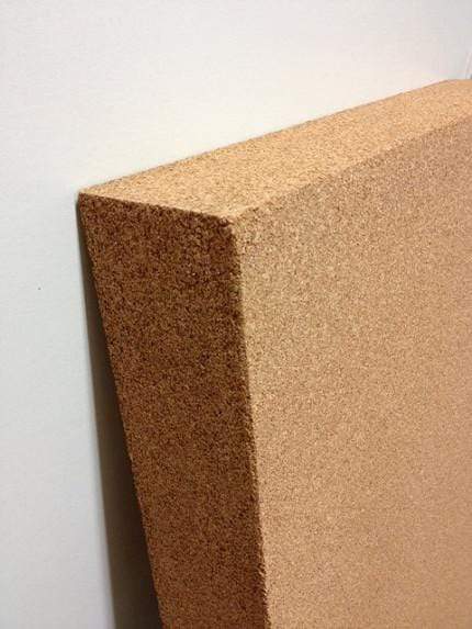 Close up view of the corner of a high density cork carving block.