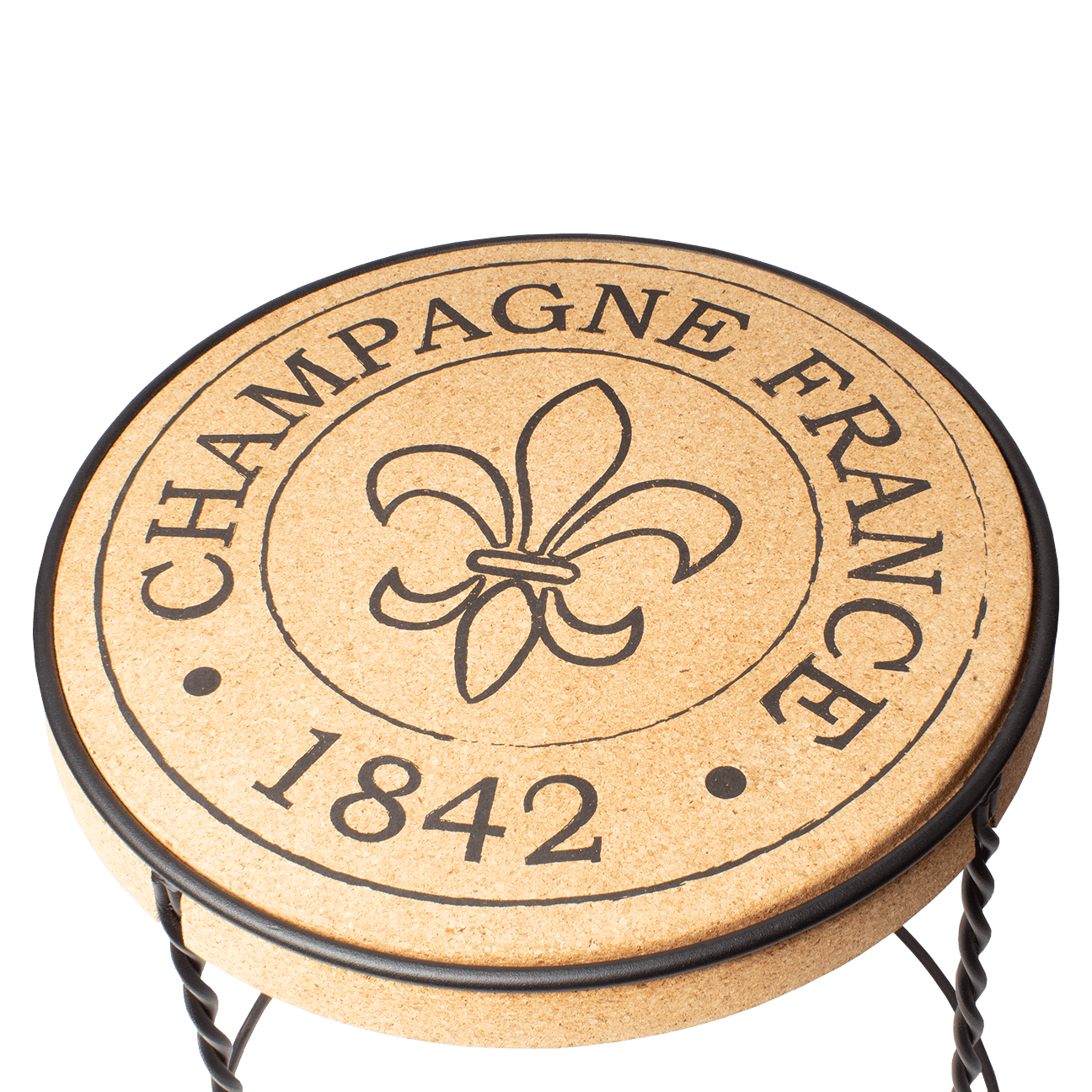 Overhead view of a table with a cork top and metal base. "Champagne France, 1842" printed on the cork top. 