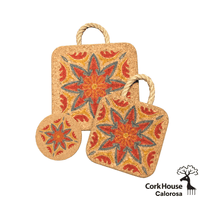 All three pieces in the azuljos Calorosa collection. The large 8in hot pad, small 6in hot pad both with a rope handle and coaster. Each item has a red and orange floral tile print outlined in a green/blue. 