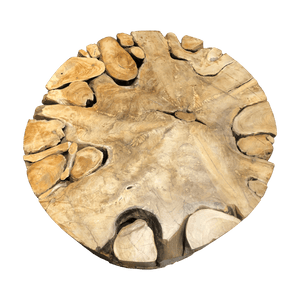 This close-up overhead view of the teak coffee table shows the assembled teak root pieces fitted together with grooves in between. 