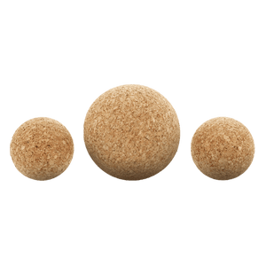 Close up of two 2-inch natural cork massage balls and one 3-inch natural cork massage balls. 