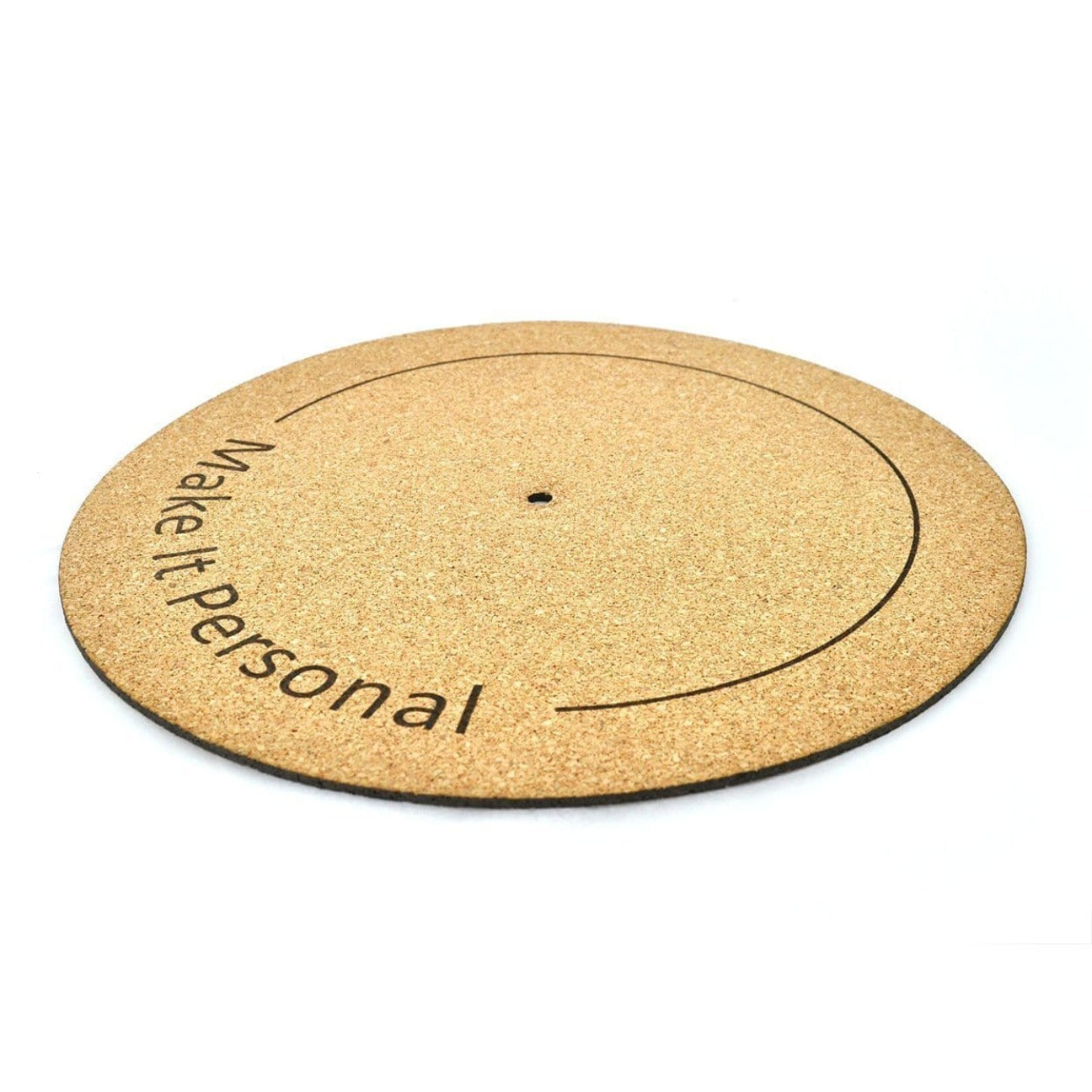 Side view of a natural cork turntable mat with a black circular line with "make it personal" written on the mat.